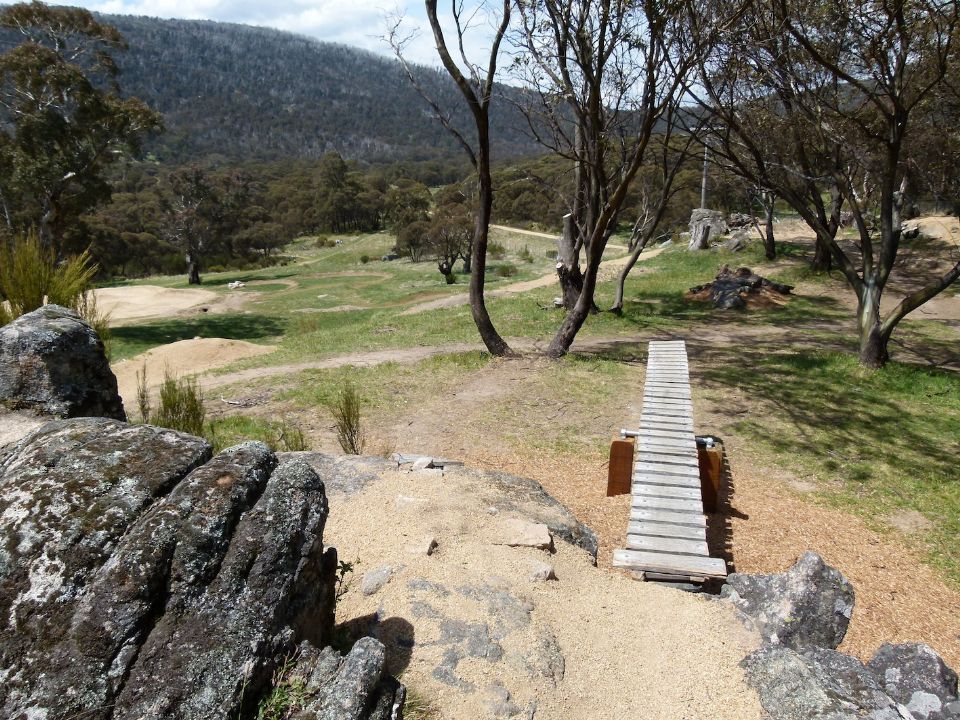 See saw to log and rock pile