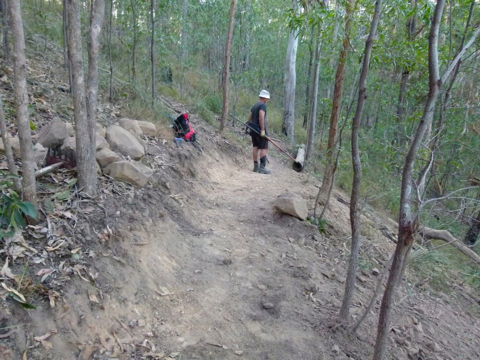 Trail will be well uphill of the log